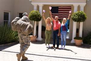 excited-caucasian-family-with-flags-cheering-milit-2023-11-27-04-55-27-utc (1)